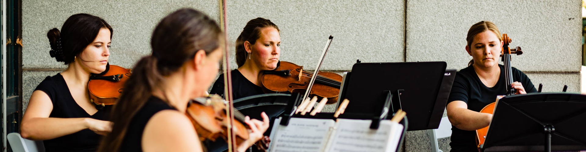 women of Asteria Music playing string instruments