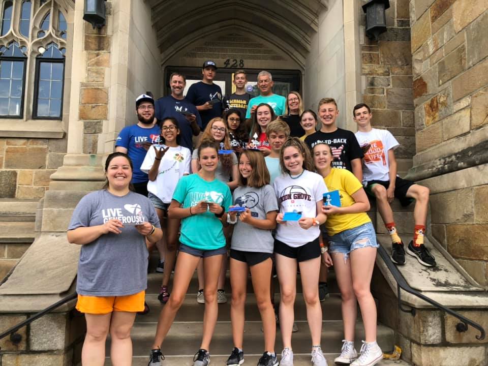 youths standing on church steps